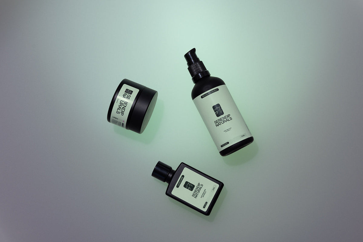 Serendip Naturals best selling skincare products — moisturiser jar, face wash bottle and elixir on a soft green background