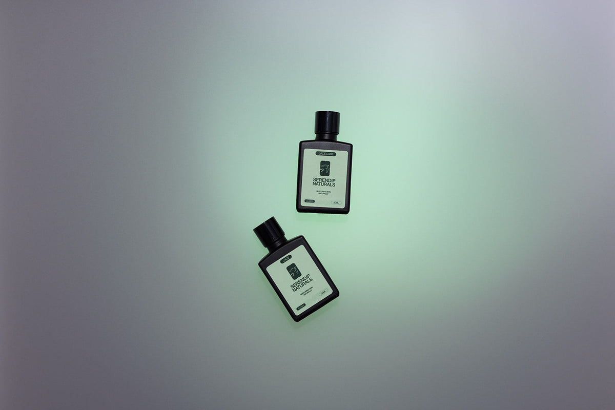 Two Serendip Naturals elixir bottles on a soft green background